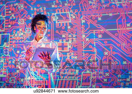 Female scientist using digital tablet with graphical electronic circuit projection View Large Photo Image Stock Image - Female scientist using digital tablet with graphical electronic circuit projection. Fotosearch