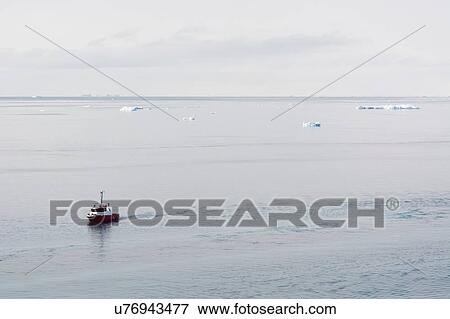 Fishing boat in Disko Bay, Ilulissat, Greenland View Large Photo Image Stock Photo - Fishing boat in Disko Bay, Ilulissat, Greenland. Fotosearch