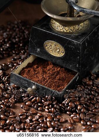 Freshly ground coffee in vintage coffee grinder and raw coffee beans View Large Photo Image Stock Photograph - Freshly ground coffee in vintage coffee grinder and raw coffee beans. Fotosearch