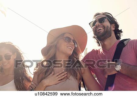 Friends laughing and enjoying themselves View Large Photo Image Stock Photo - Friends laughing and enjoying themselves. Fotosearch
