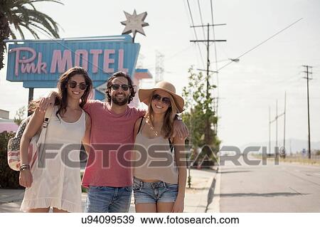 Friends posing in front of motel, Los Angeles, California, USA View Large Photo Image Stock Photo - Friends posing in front of motel, Los Angeles, California, USA. Fotosearch