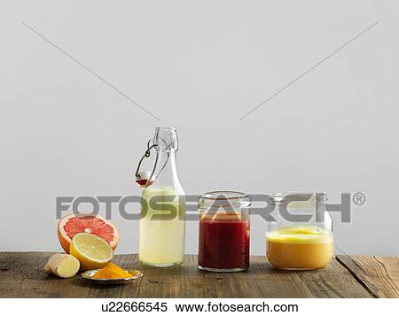 Fruit smoothies in glass bottle and jars, white background View Large Photo Image Stock Photography - Fruit smoothies in glass bottle and jars, white background. Fotosearch