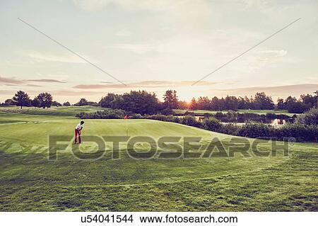 Golfer on course, Korschenbroich, Dusseldorf, Germany View Large Photo Image Picture - Golfer on course, Korschenbroich, Dusseldorf, Germany. Fotosearch