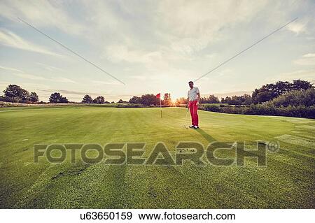 Stock Photo - Golfer on course, Korschenbroich, Dusseldorf, Germany. Fotosearch