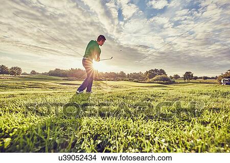 Golfer playing golf on course, Korschenbroich, Dusseldorf, Germany View Large Photo Image Picture - Golfer playing golf on course, Korschenbroich, Dusseldorf, Germany. Fotosearch