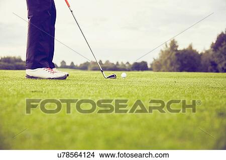 Picture - Golfer playing golf on course, Korschenbroich, Dusseldorf, Germany. Fotosearch