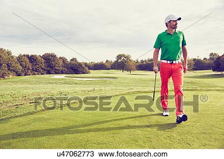 Golfer walking on course, Korschenbroich, Dusseldorf, Germany View Large Photo Image Stock Image - Golfer walking on course, Korschenbroich, Dusseldorf, Germany. Fotosearch