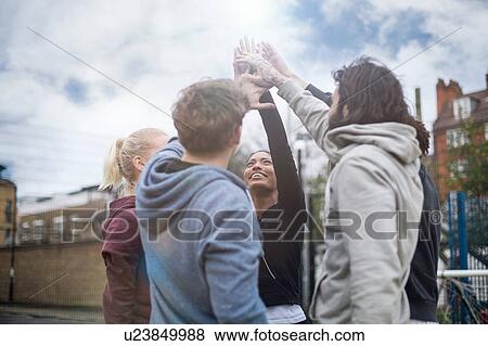 Group of adults, touching hands, outdoors View Large Photo Image Stock Photo - Group of adults, touching hands, outdoors. Fotosearch