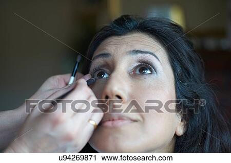 Hands of female make up artist applying eye pencil to clients eye View Large Photo Image Stock Image - Hands of female make up artist applying eye pencil to clients eye. Fotosearch