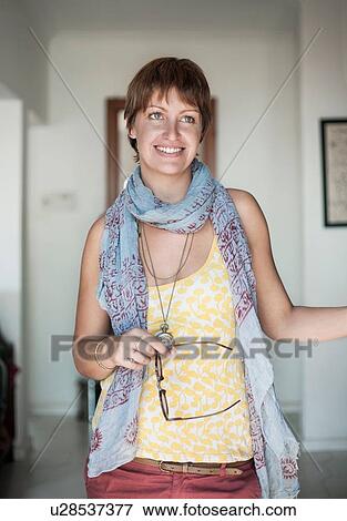 Stock Photo - Happy young woman with cropped hair. Fotosearch