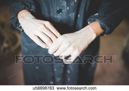 High angle cropped view of young womans clay covered hands View Large Photo Image Stock Image - High angle cropped view of young womans clay covered hands. Fotosearch