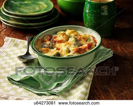 High angle view of broccoli and cheese bake in oval dish View Large Photo Image Stock Image - High angle view of broccoli and cheese bake in oval dish. Fotosearch