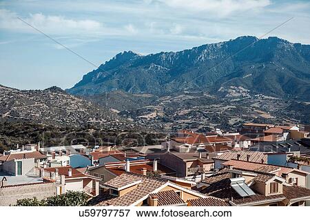 High angle view of buildings in Orgosolo and mountain range, Sardinia, Italy View Large Photo Image Stock Photo - High angle view of buildings in Orgosolo and mountain range, Sardinia, Italy. Fotosearch