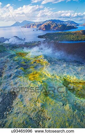 High angle view of coast and sulphur smoke at Gran Cratere, Vulcano Island, Aeolian Islands, Sicily, Italy View Large Photo Image Stock Photograph - High angle view of coast and sulphur smoke at Gran Cratere, Vulcano Island, Aeolian Islands, Sicily, Italy. Fotosearch