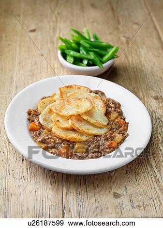 High angle view of minced lamb hotpot with sliced green beans View Large Photo Image Stock Photo - High angle view of minced lamb hotpot with sliced green beans. Fotosearch