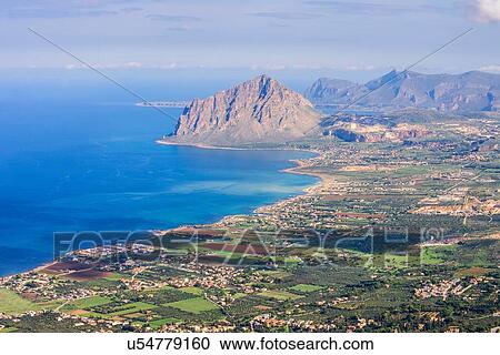 Stock Image - High angle view of Monte Cofano and coastline, Erice, Sicily, Italy. Fotosearch