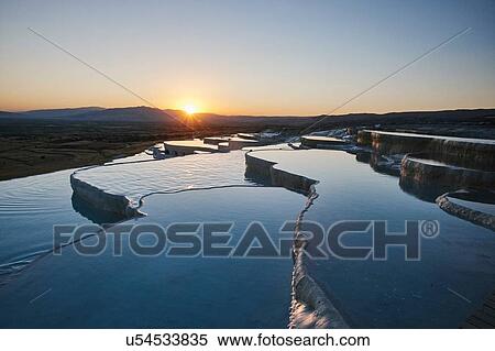 Stock Photography - Hot spring terraces at sunset, Pamukkale, Anatolia, Turkey. Fotosearch