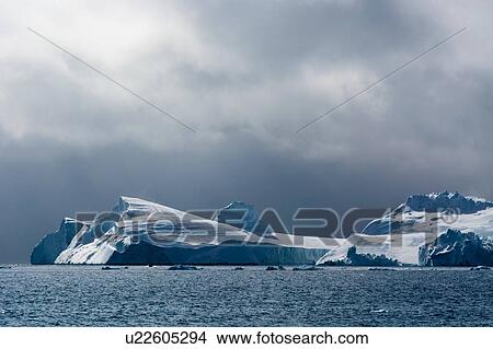 Icebergs and overcast sky, Ilulissat icefjord, Disko Bay, Greenland View Large Photo Image Picture - Icebergs and overcast sky, Ilulissat icefjord, Disko Bay, Greenland. Fotosearch