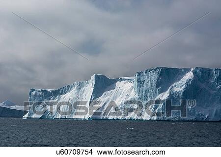 Icebergs and overcast sky, Ilulissat icefjord, Disko Bay, Greenland View Large Photo Image Picture - Icebergs and overcast sky, Ilulissat icefjord, Disko Bay, Greenland. Fotosearch