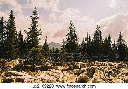 Landscape with rocks, forest and distant mountains, Ural Mountains, Russia View Large Photo Image Stock Image - Landscape with rocks, forest and distant mountains, Ural Mountains, Russia. Fotosearch