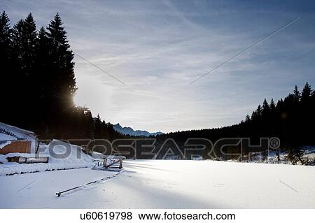 Landscape with snow covered lake, Berg, Bavaria, Germany View Large Photo Image Stock Photo - Landscape with snow covered lake, Berg, Bavaria, Germany. Fotosearch