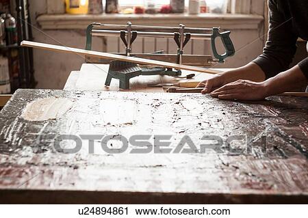 Male artist, framing artwork, close-up View Large Photo Image Stock Image - Male artist, framing artwork, close-up. Fotosearch