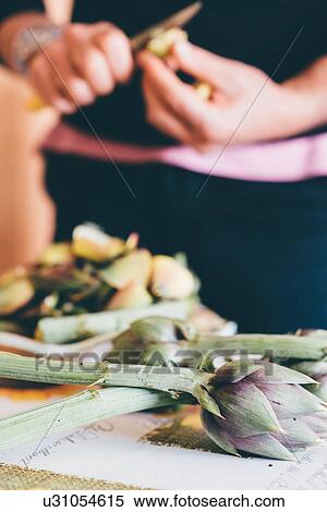 Male hands preparing globe artichokes in kitchen View Large Photo Image Stock Photography - Male hands preparing globe artichokes in kitchen. Fotosearch