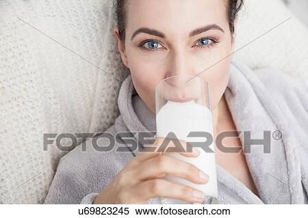 Stock Photography - Mature drinking a glass of milk. Fotosearch
