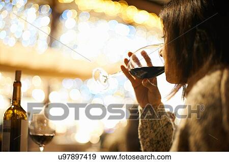Mature female drinking red wine in wine bar, Seville, Spain View Large Photo Image Stock Photo - Mature female drinking red wine in wine bar, Seville, Spain. Fotosearch