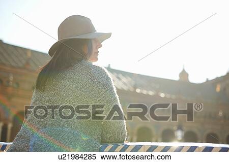 Mature female tourist looking out at Plaza de Espana, Seville, Spain View Large Photo Image Stock Photography - Mature female tourist looking out at Plaza de Espana, Seville, Spain. Fotosearch