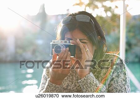Mature female tourist photographing at Guadalqivir river, Seville, Spain View Large Photo Image Stock Image - Mature female tourist photographing at Guadalqivir river, Seville, Spain. Fotosearch