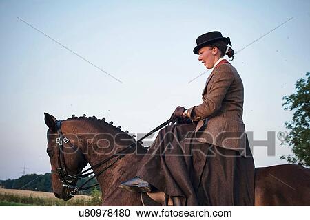 Mid adult woman riding and training dressage horse in field View Large Photo Image Stock Image - Mid adult woman riding and training dressage horse in field. Fotosearch