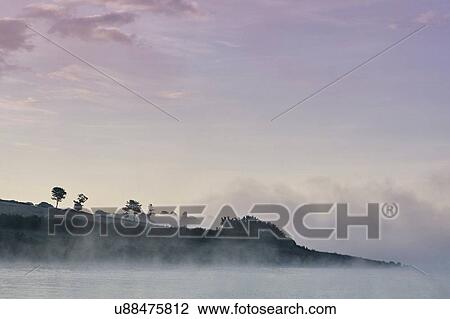 Mist over Wimbleball lake at dawn, Exmoor, Somerset, England View Large Photo Image Stock Image - Mist over Wimbleball lake at dawn, Exmoor, Somerset, England. Fotosearch