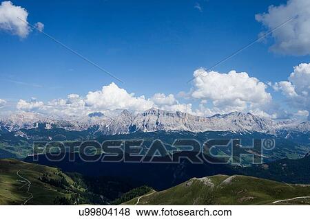 Stock Photo - Mountain landscape and blue sky, Brixen, Dolomites, Austria. Fotosearch