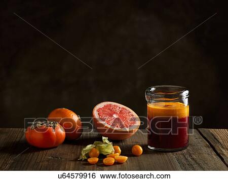 Orange raw juice in a jar with fruits View Large Photo Image Stock Photograph - Orange raw juice in a jar with fruits. Fotosearch