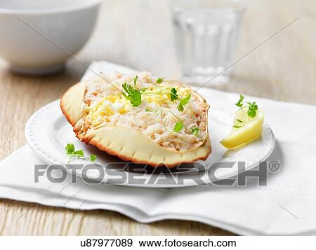 Orkney crab in shell with herbs and lemon wedge View Large Photo Image Stock Photo - Orkney crab in shell with herbs and lemon wedge. Fotosearch