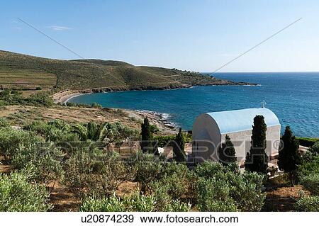 Stock Photo - Orthodox chapel overlooking the sea, Syros, Cyclades Islands, Aegean sea, Greece. Fotosearch
