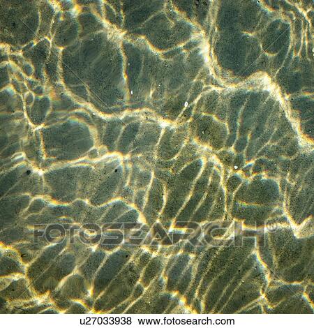 Overhead detail of sunlight on sea water View Large Photo Image Stock Photo - Overhead detail of sunlight on sea water. Fotosearch