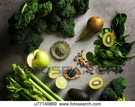 Overhead view of green colour fruit and vegetables View Large Photo Image Stock Photo - Overhead view of green colour fruit and vegetables. Fotosearch