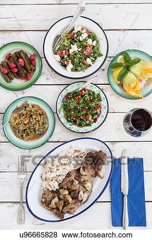 Overhead view of meal with a variety of salads and savoury food, Alacati, Turkey View Large Photo Image Stock Photo - Overhead view of meal with a variety of salads and savoury food, Alacati, Turkey. Fotosearch
