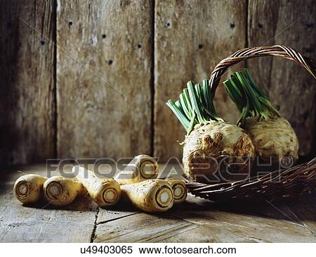 Stock Photography - Parsnips and celeriac is wicker basket. Fotosearch
