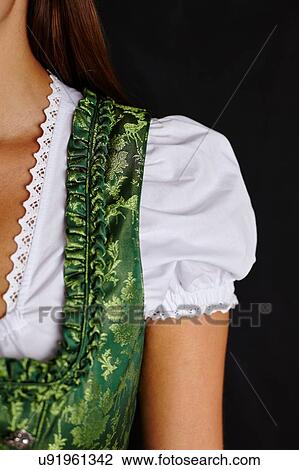 Stock Image - Partial view of young woman in Dirndl. Fotosearch