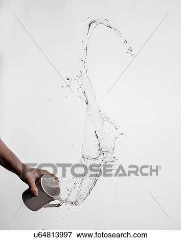 Person throwing mug of water, white background View Large Photo Image Stock Photo - Person throwing mug of water, white background. Fotosearch