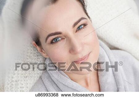 Stock Photo - Portrait of a mature woman, wearing bathrobe. Fotosearch