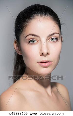 Portrait of bare shoulder young woman looking at camera View Large Photo Image Stock Photograph - Portrait of bare shoulder young woman looking at camera. Fotosearch