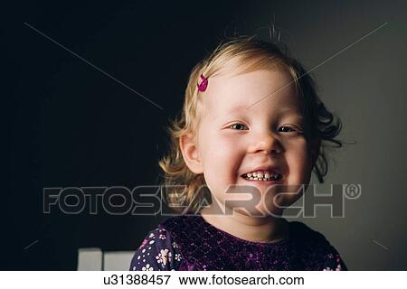 Portrait of cute girl with blond wavy hair View Large Photo Image Stock Photo - Portrait of cute girl with blond wavy hair. Fotosearch