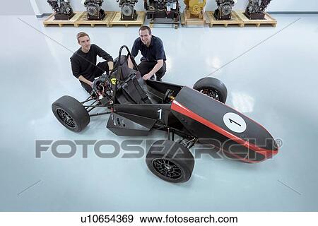 Portrait of engineering students with faculty racing car, elevated view View Large Photo Image Stock Photo - Portrait of engineering students with faculty racing car, elevated view. Fotosearch