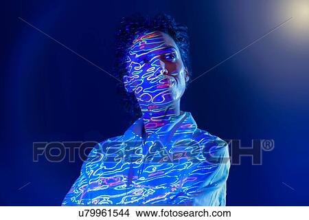Portrait of female scientist with graphical geological data projection View Large Photo Image Picture - Portrait of female scientist with graphical geological data projection. Fotosearch