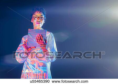 Portrait of female scientist with electronic graphical projection View Large Photo Image Stock Image - Portrait of female scientist with electronic graphical projection. Fotosearch