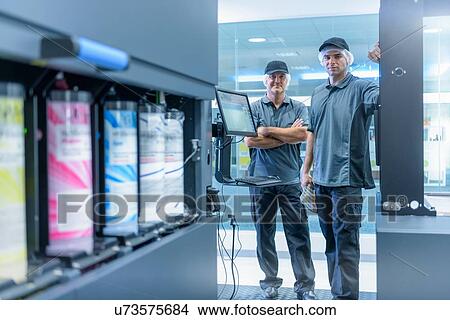 Portrait of workers in food packaging printing factory View Large Photo Image Picture - Portrait of workers in food packaging printing factory. Fotosearch